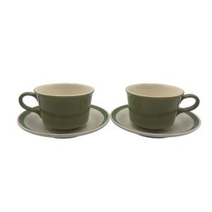 Set Of Two Ceramic Teacups With Matching Saucers Green And White Accent Design